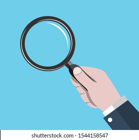 businessman hand holding magnifying find something, search concept