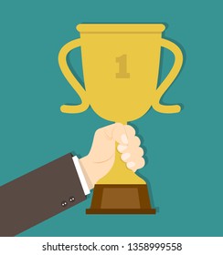 Businessman Hand holding trophy