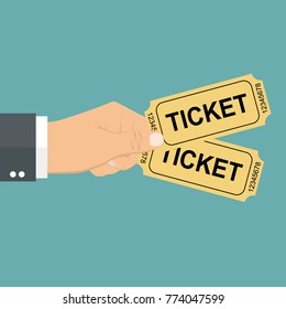 Businessman Hand Holding Two Tickets