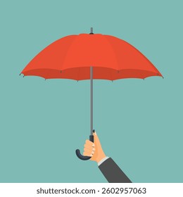 Businessman hand holding umbrella as a concept of security of property, protection or insurance coverage