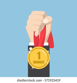 Businessman hand holding winner medal, competition winner concept