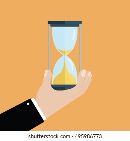 Businessman hand holds a hourglass. Business and time management concept. vector