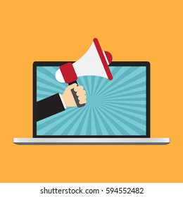 Businessman hand from laptop computer holding megaphone for advertising.
