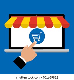 Businessman hand point to shopping cart for online paying on computer laptop screen with awning on blue background. Vector illustration business online shopping concept flat design.