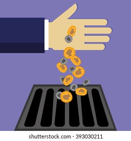 Businessman hand pouring money down the drain in the form of gold and silver coins