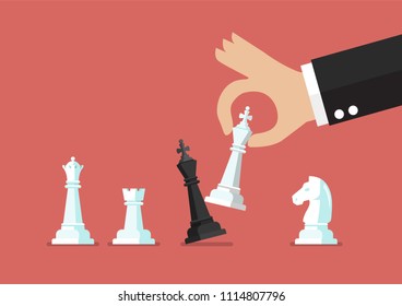 Businessman hand use white king checkmate the black king. Business strategy concept