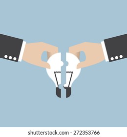 Businessman hands assembling pieces of light bulb jigsaw puzzle, teamwork, brainstorm concept, VECTOR, EPS10