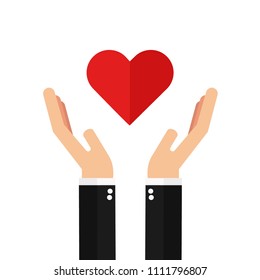 Businessman hands holding red heart