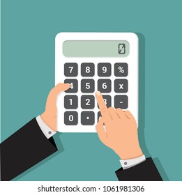 businessman hands using a calculator