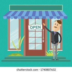 Businessman hang a sign "open" on the front door. Business man open new office