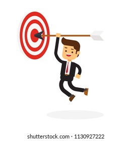 Businessman hanging arrow on target