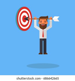 Businessman hanging arrow on target