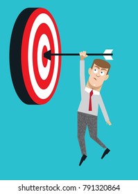 Businessman hanging from target