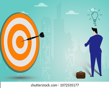 Businessman have a good idea and look at the darts in the middle of the target on city landscape,business concept vector eps10.