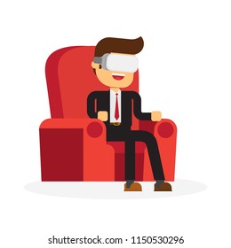 Businessman having a good time sitting in armchair wearing virtual reality helmet