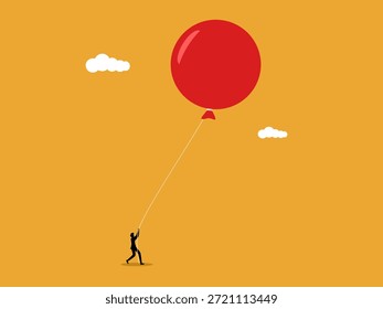 Un hombre de negocios sujetó los globos para evitar que flotaran