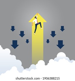 Businessman hold rising yellow arrow go different way from group of blue, finance concept