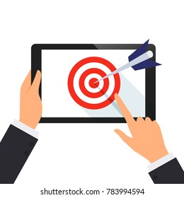 Businessman hold tablet and point on the screen with the dart of target concept vector illustration