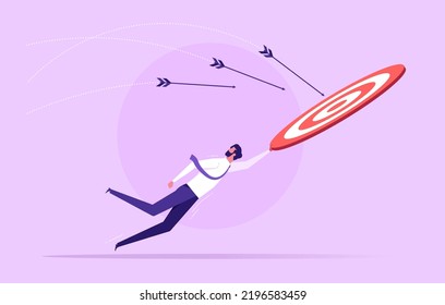 Businessman holding big target and try to achieve a target goals, control to reach goal, competition or challenge to success, aiming or motivation concept