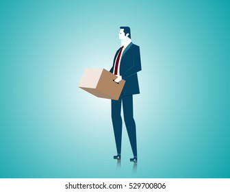 Businessman holding a box, stand in an empty