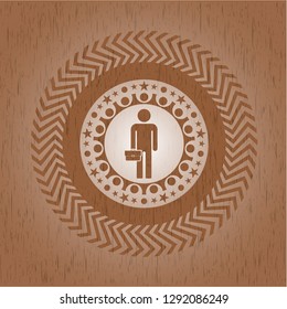businessman holding briefcase icon inside badge with wooden background