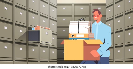 businessman holding cardboard box with documents in filing wall cabinet with open drawer data archive storage business administration paper work concept horizontal portrait vector illustration