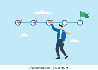 Businessman holding checkmark symbol to check completed tasks. Concept of project tracking, and using checklist to monitor project progress