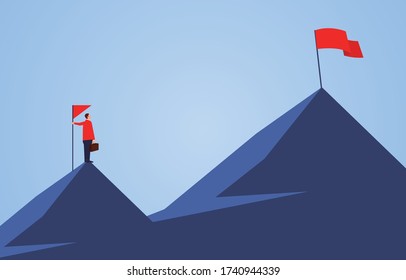 Businessman holding a flag standing on the top of the mountain, looking to another higher mountain, business goals and challenges