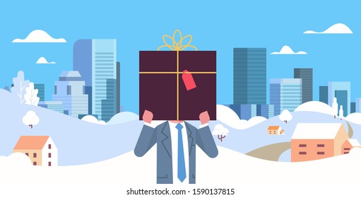 businessman holding gift box in front of face christmas new year winter holidays celebration concept snowfall cityscape background horizontal flat portrait vector illustration