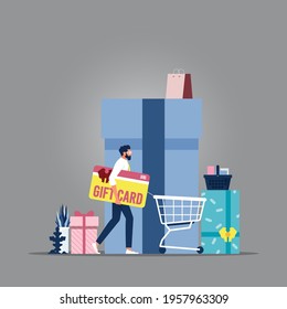 Businessman holding huge gift card with shopping cart, Discount gift card, voucher, certificate marketing strategy