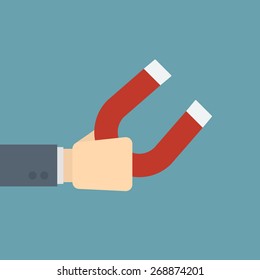businessman holding magnet