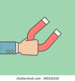 businessman holding magnet