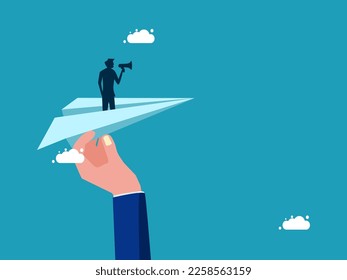 Businessman holding a megaphone on a paper plane. Help support advertising and marketing. business concept 