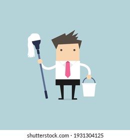Businessman holding mop and bucket. Cleaning the workplace concept.
