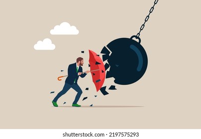 Businessman holding an open red umbrella which protects from a collision with a broken wrecking ball. Safety measures. IT defense. Insurance and protection. 