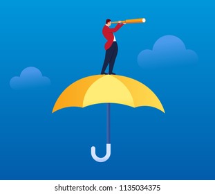 Businessman holding a telescope standing on an umbrella