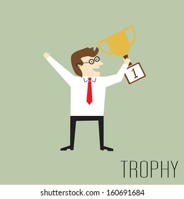 Businessman holding a trophy