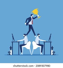 Businessman holding trophy to be successful by standing on his employee back, representing to boss using office worker as labor job, business competition and unfair practice concept
