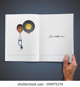 Businessman holding a vinyl printed on book