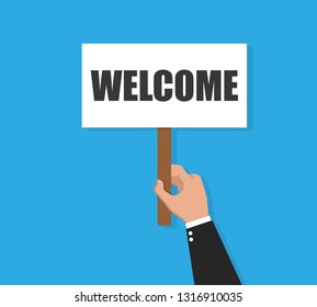 Businessman holding welcome banner