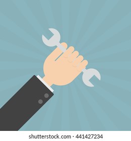 businessman holding wrench