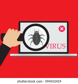 Businessman holds a magnifying glass, finds a red malware computer bug,a virus on laptop notebook.