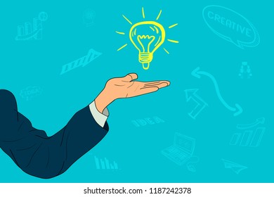 A businessman holds on hand an idea