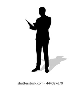 Businessman holds tablet in hand. Standing man in suit, vector silhouette