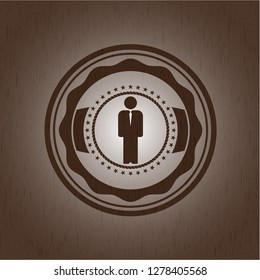 businessman icon inside wood badge or emblem