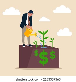 Businessman investor holding watering can to watering grow sprout seedling he plant from dollar sign. Dividend investment, prosperity and economic growth or saving and business profit concept.