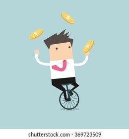 Businessman juggling coin while cycling