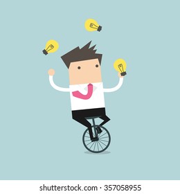 Businessman juggling light bulb while cycling