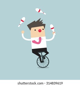 Businessman juggling while cycling with red nose