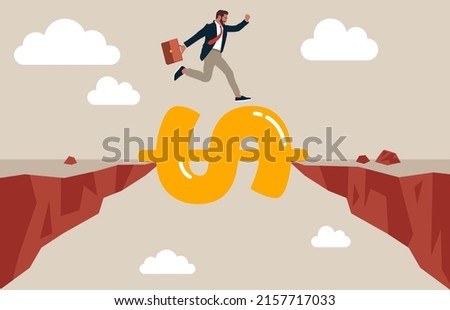Businessman jump pass cliff gap with money dollar sign bridge. Money to rescue or support business to survive, financial help solution to get pass crisis, budget or loan payment concept.